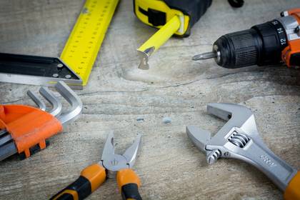Hand tools laid out on a bench